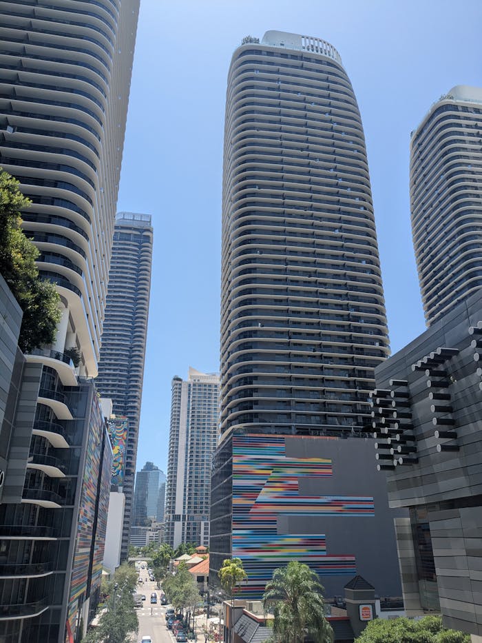 A view of modern architectural skyscrapers under a clear blue sky in Downtown Miami.